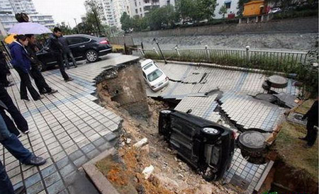 World Sinkholes on Chinese Cities Are Sinking  Sinkholes Are Swallowing Up Cars     We